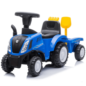 Plavi traktor New Holland za vožnju s prikolicom